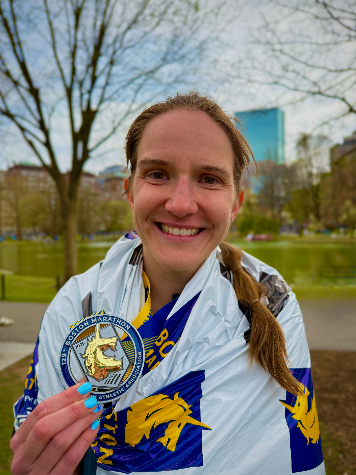 Boston Marathon finisher with medal